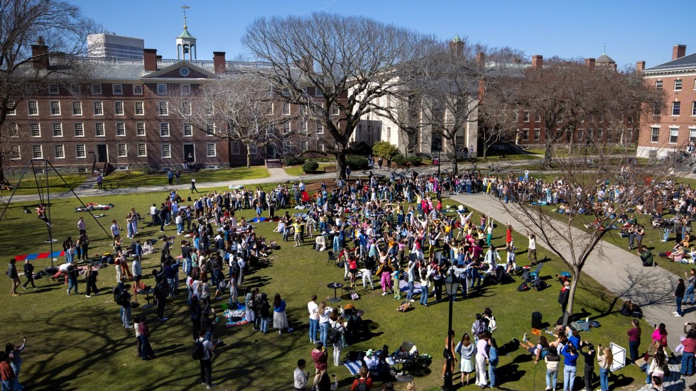 Students dance on College Green