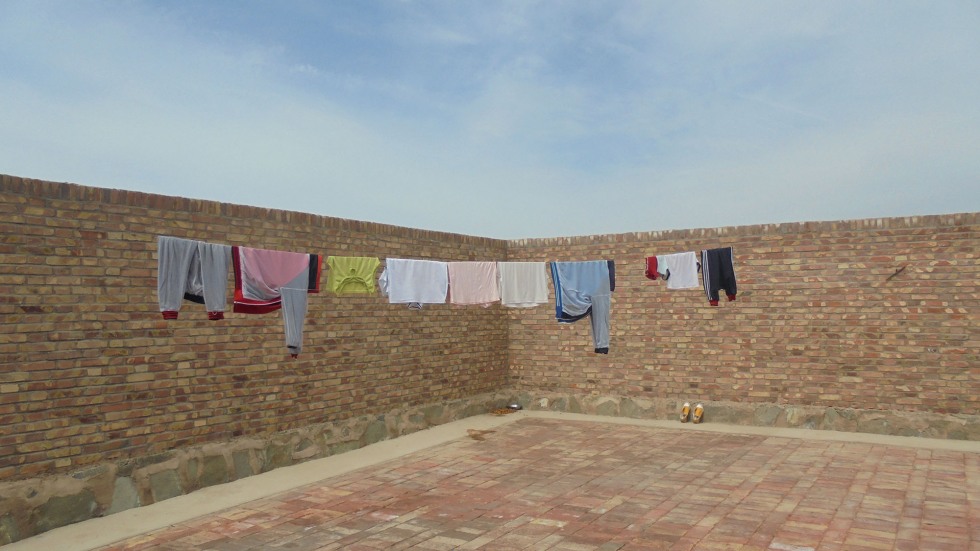 Image of full clothesline at a boarding school in Gansu, China