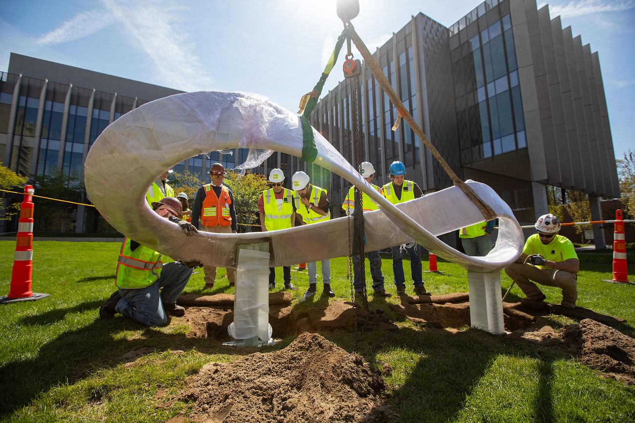 An image of a sculpture being placed in front of Brown's new engineering building