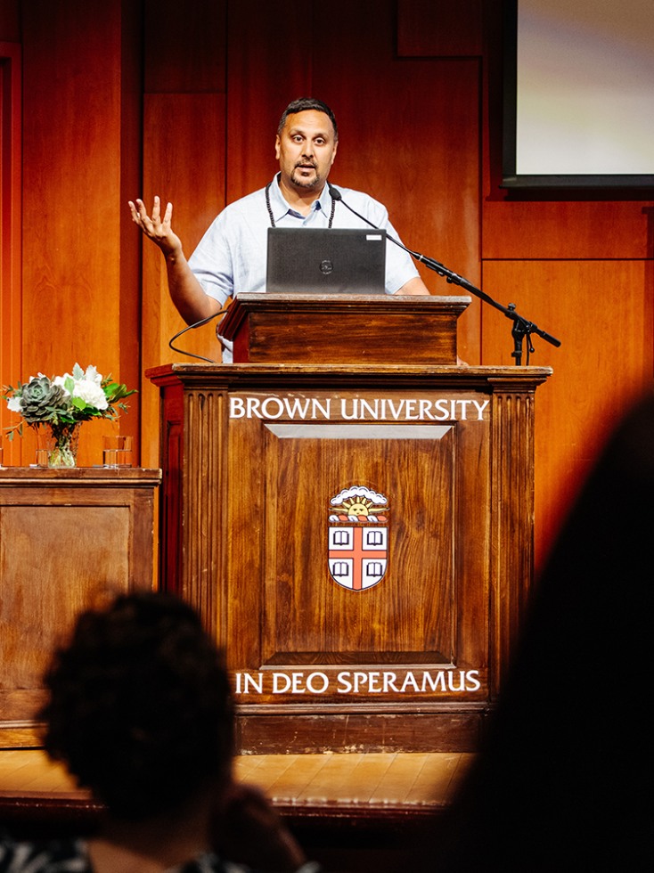Amer Ahmed speaks at a podium at Brown