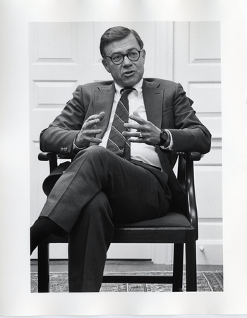 Photo of President Howard Swearer seated.