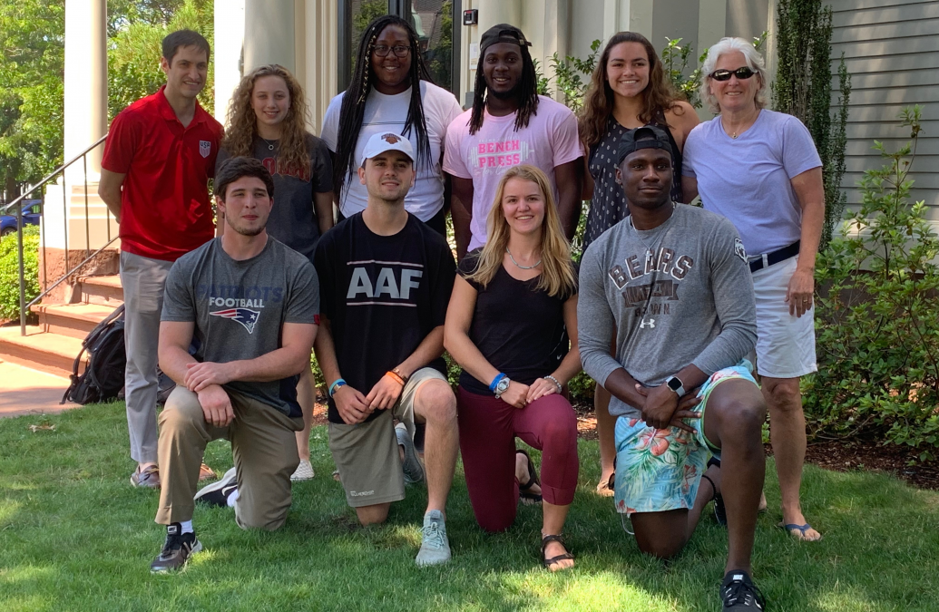 The 2019 Community Sport fellows pictured with program directors in from of the Swearer Center.