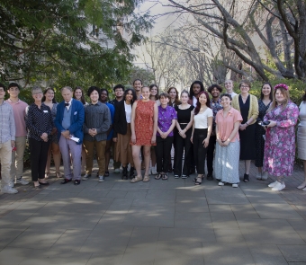Group photo of the newest cohort of Royce Fellows standing outside 