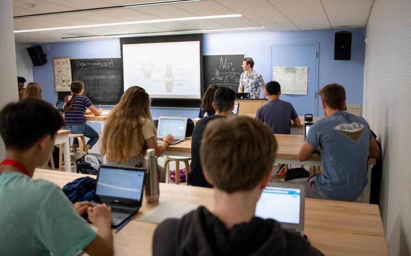 male student teacher in classroom