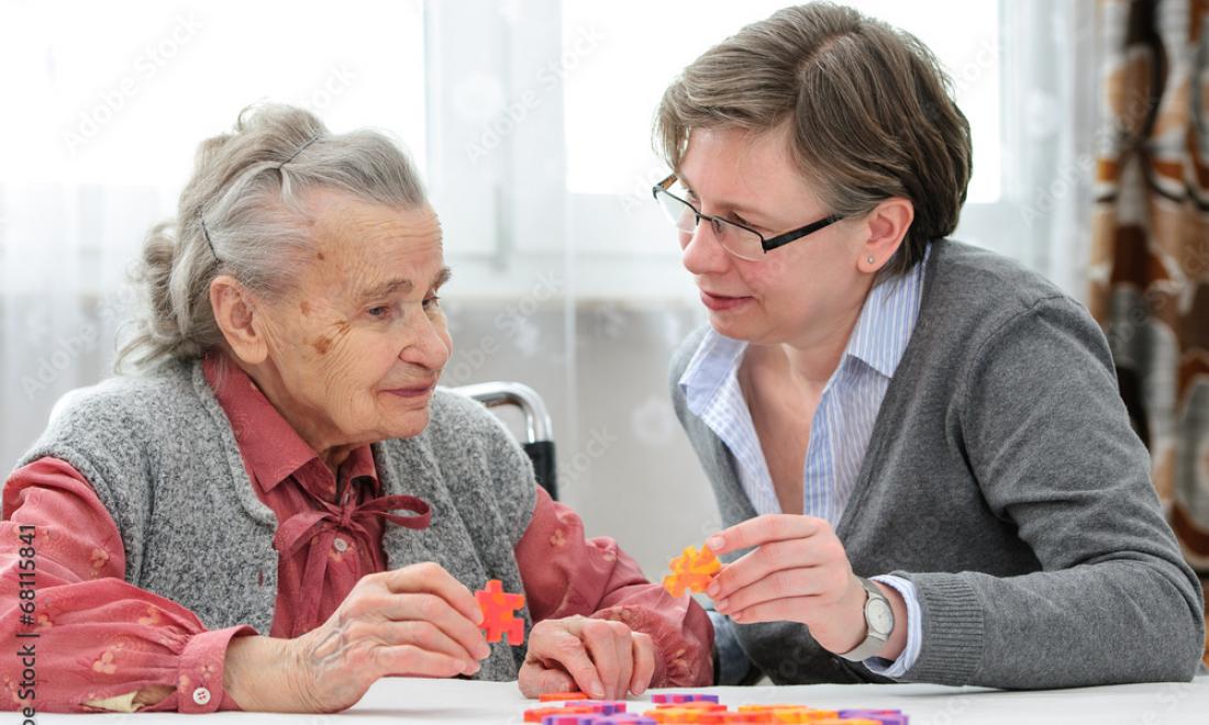 Elderly woman with health care worker