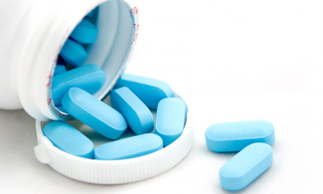 pill bottle with blue pills