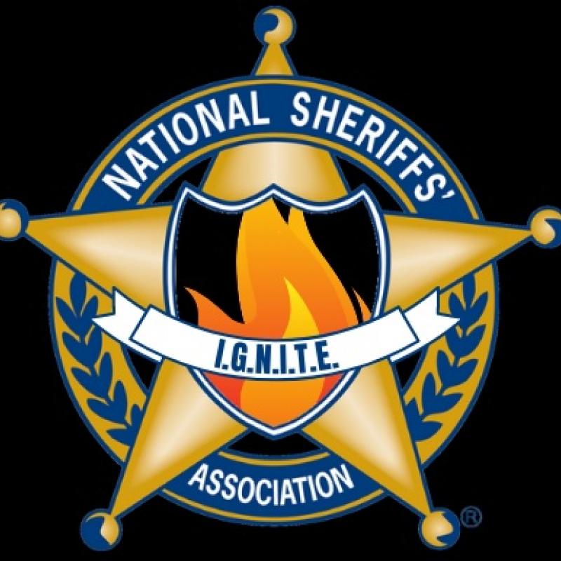 Sheriff's Badge Logo with a flame and IGNITE logo across it