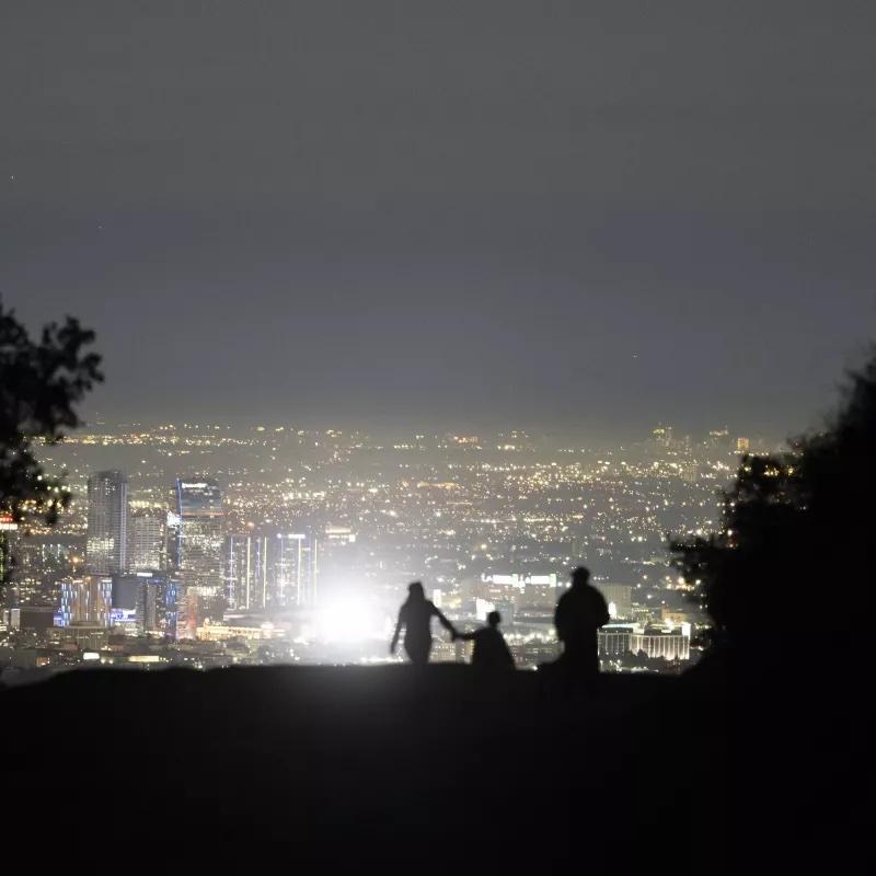 A family walks along Griffith Park in Los Angeles on Nov. 14, a day before the world’s population hit 8 billion people, according to U.N. figures.