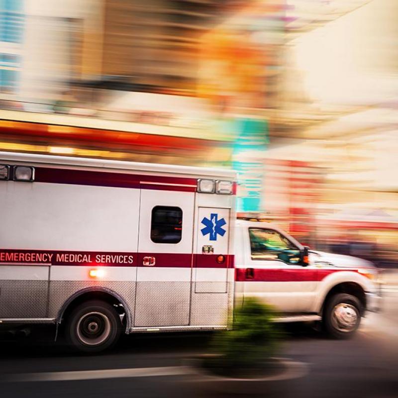 ambulance speeding down a street
