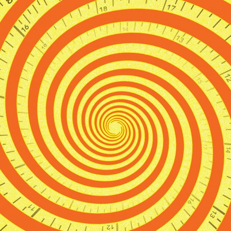 Image of bright yello and orange tape measure spiraled 