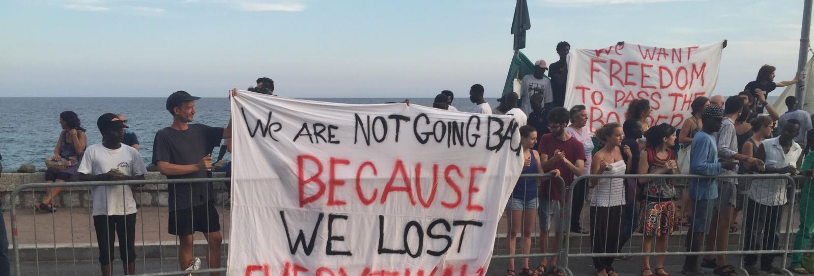 Eritrean refugees in Italy protest with sign: We are not going back because we lost everything
