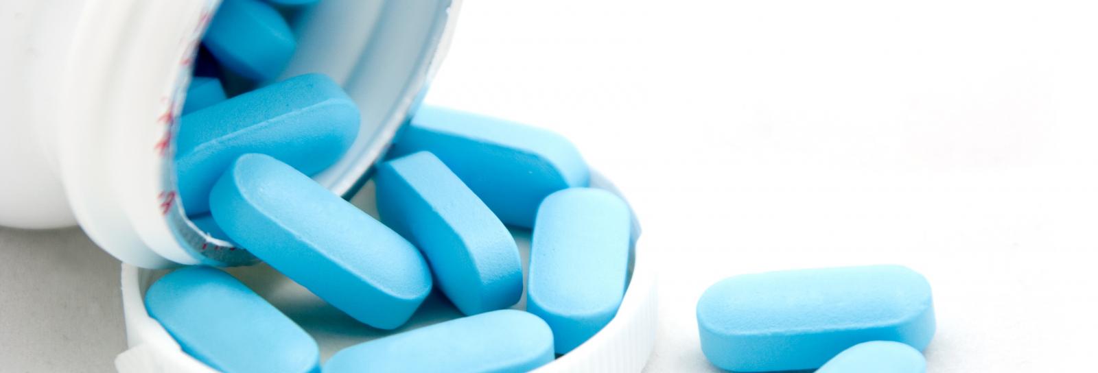 pill bottle with blue pills