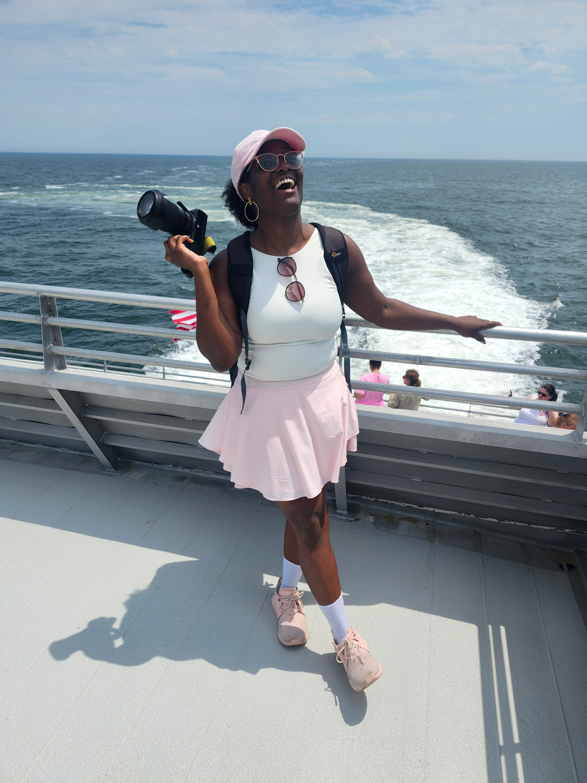 Teniesea Russell takes photos on a boat trip