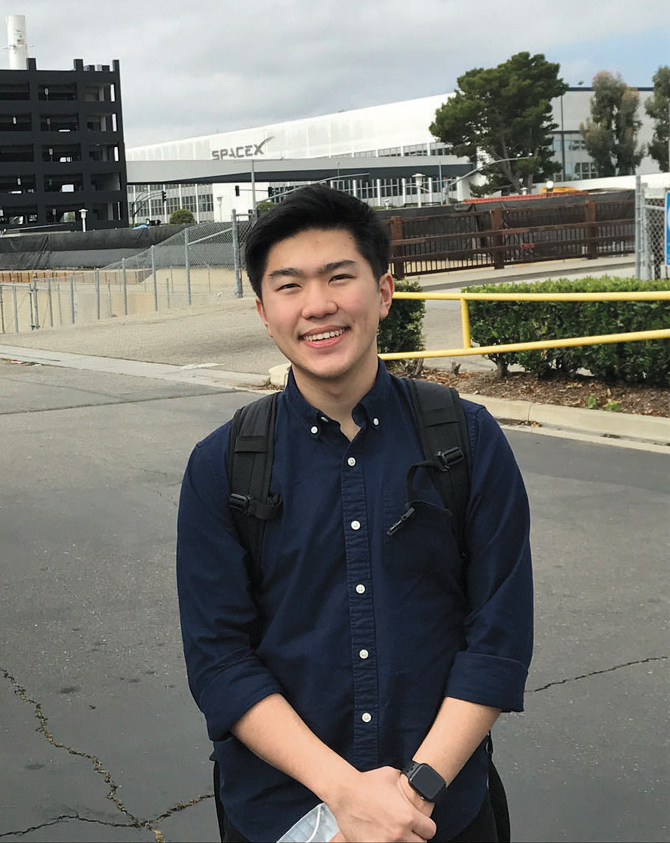 Justin Rhee standing outside the SpaceX building
