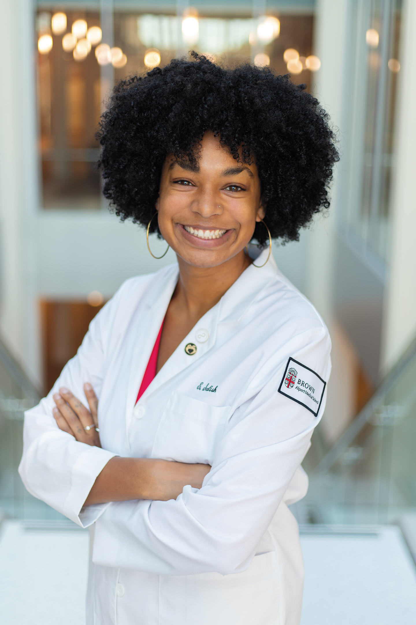 Ella Satish wearing a lab coat