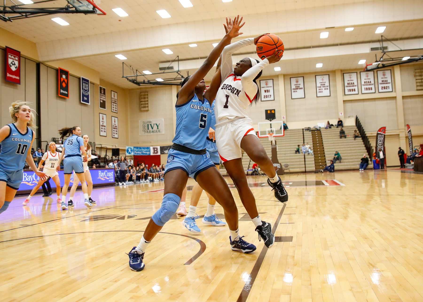 basketball player goes for the hoop