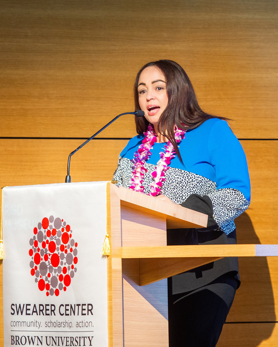 Dilania Inoa speaks at podium at a Swearer Center event