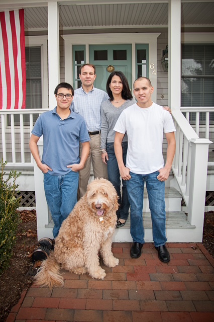 John Colarusso and family in front of their home