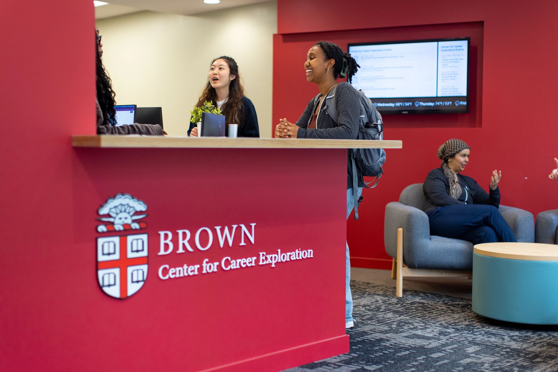 Students at the front desk in Brown's career center