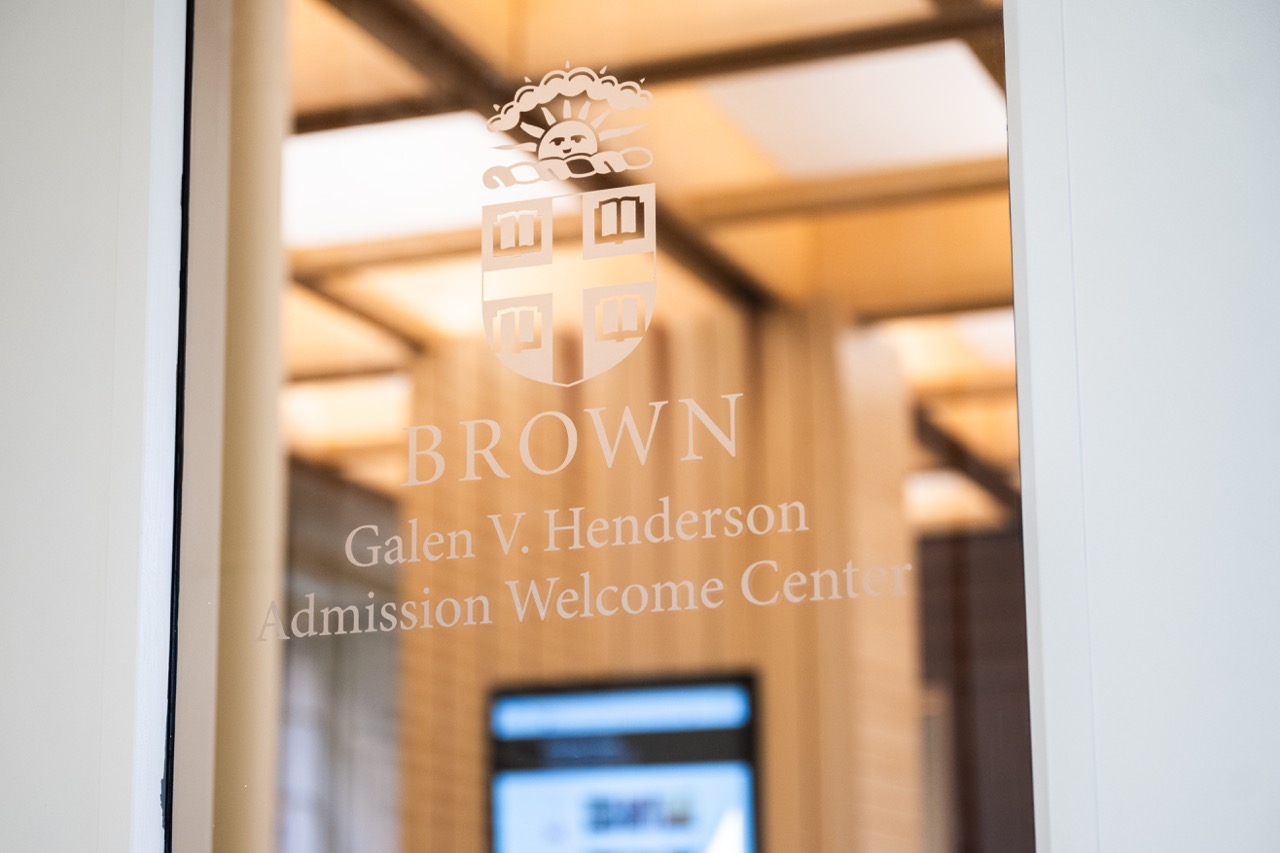 door decal that says Brown Galen V. Henderson Admission Welcome Center