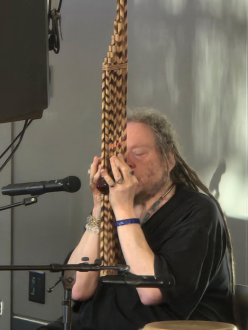 a person playing a khaen