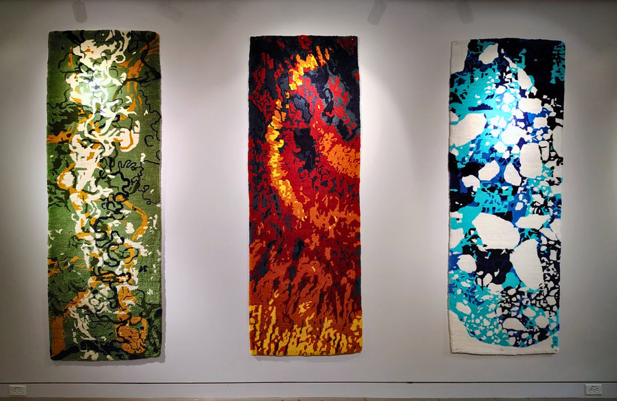 tapestries hanging on a white wall