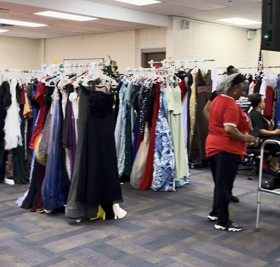families shop among racks of prom dresses