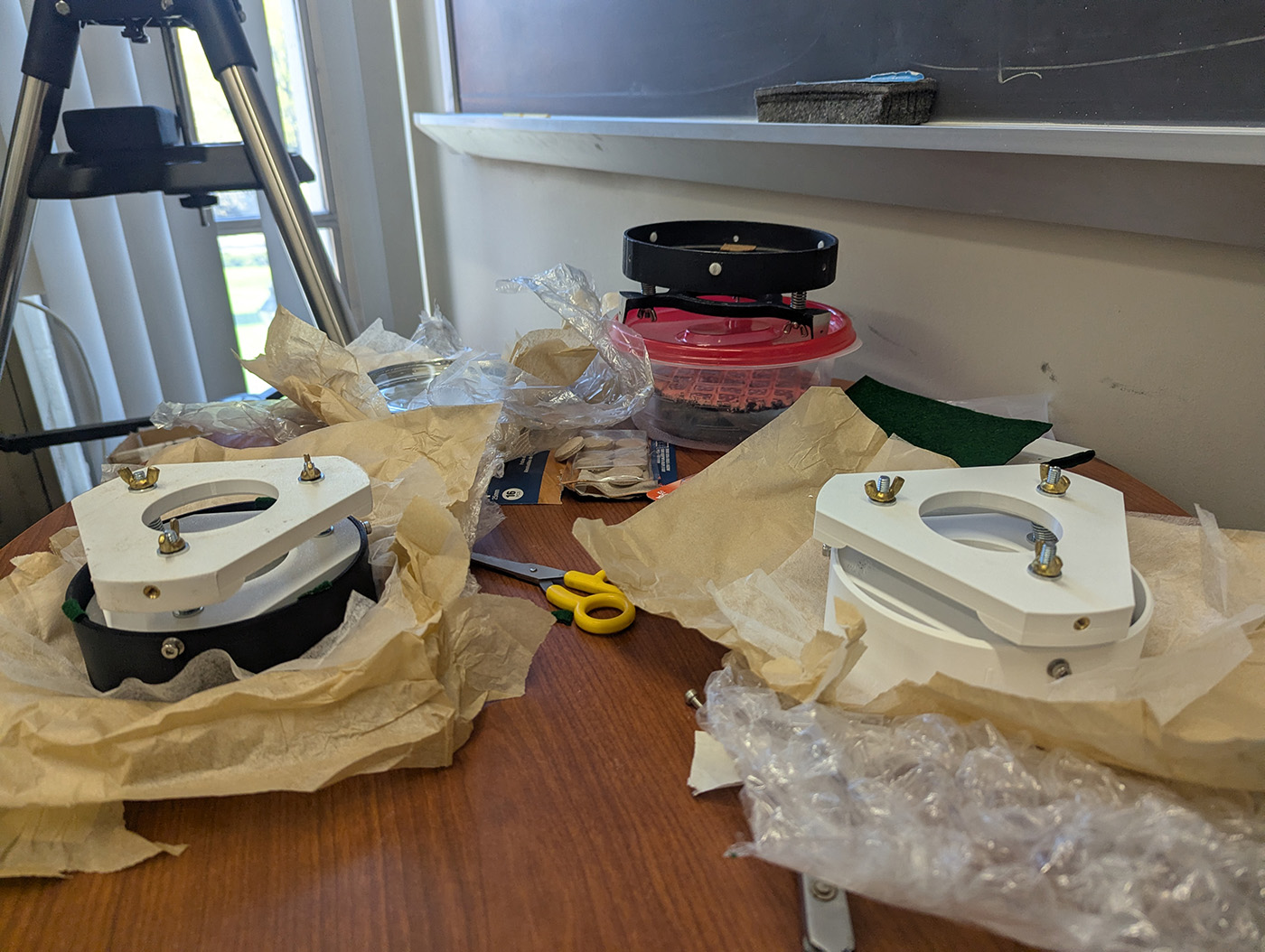 mounts for telescope mirrors sitting on a table
