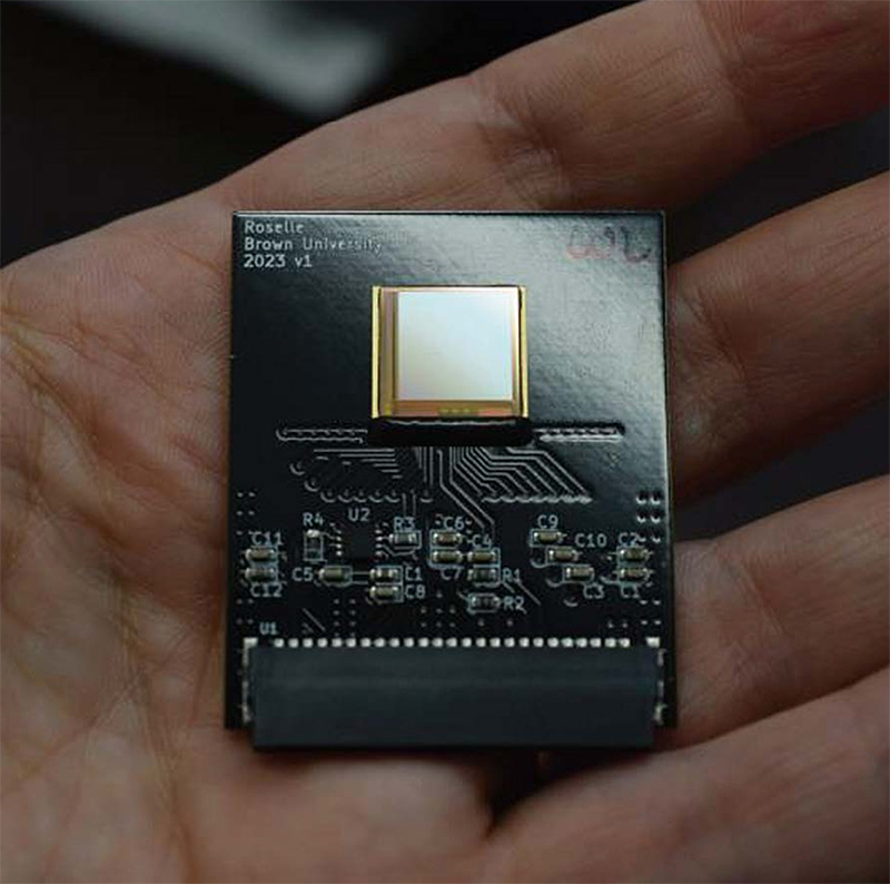 a microchip sitting in a person's hand
