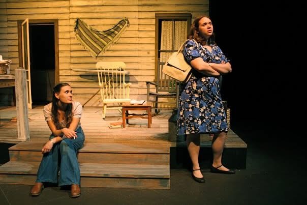 two college students perform a play on stage at  the University of Rhode Island.