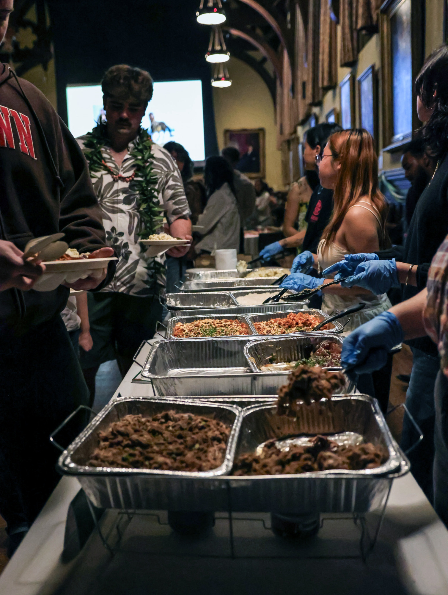 Attendees are served traditional Hawaiian and fusion dishes from Manoa Poke