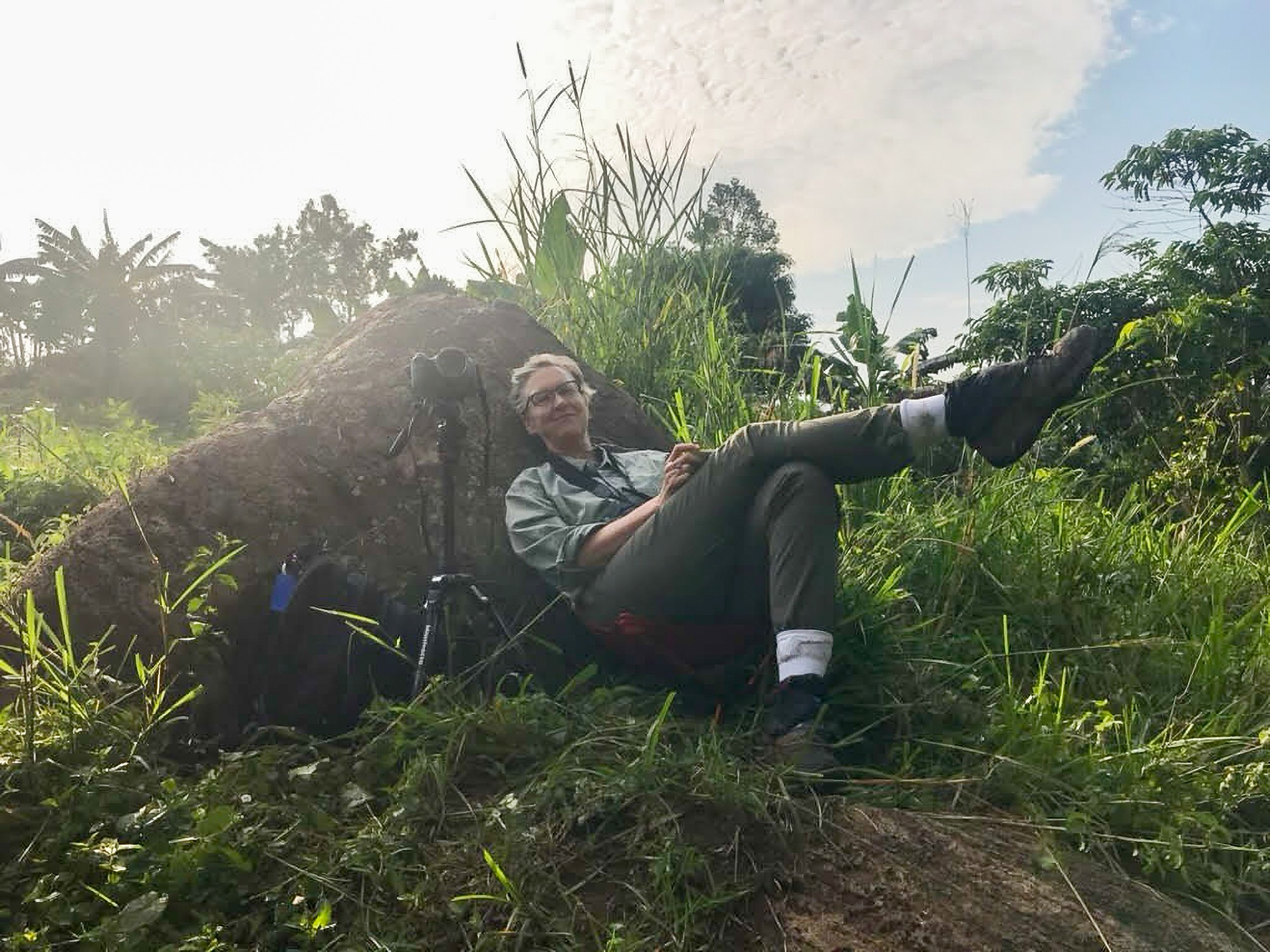 Nancy Jacobs reclines in the forest