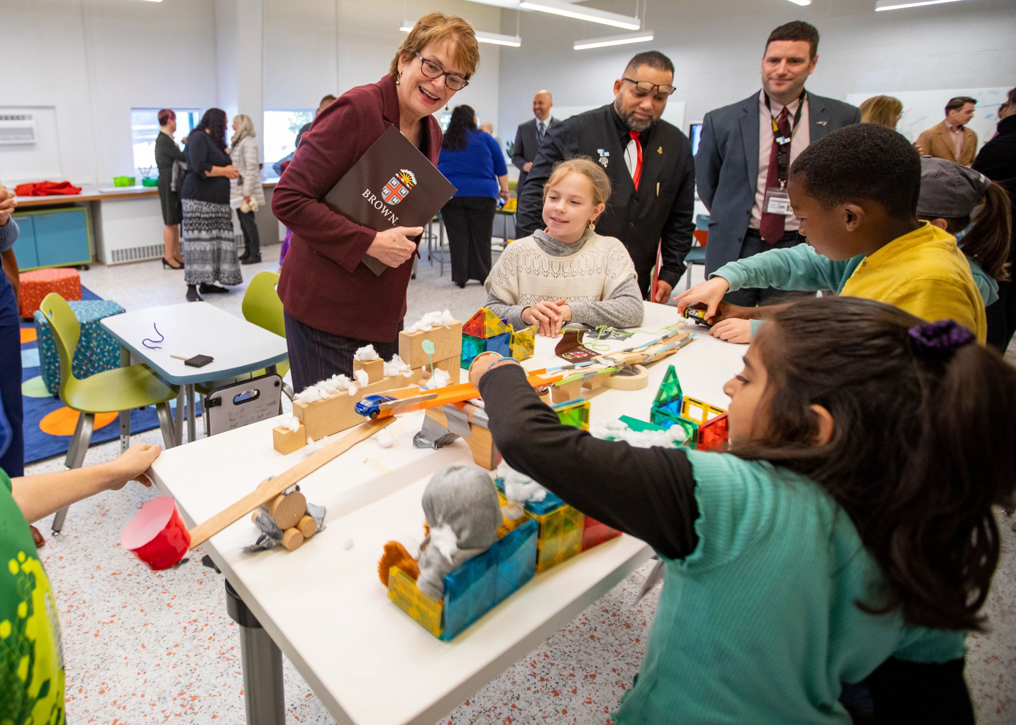 President Paxson speaks with elementary school students