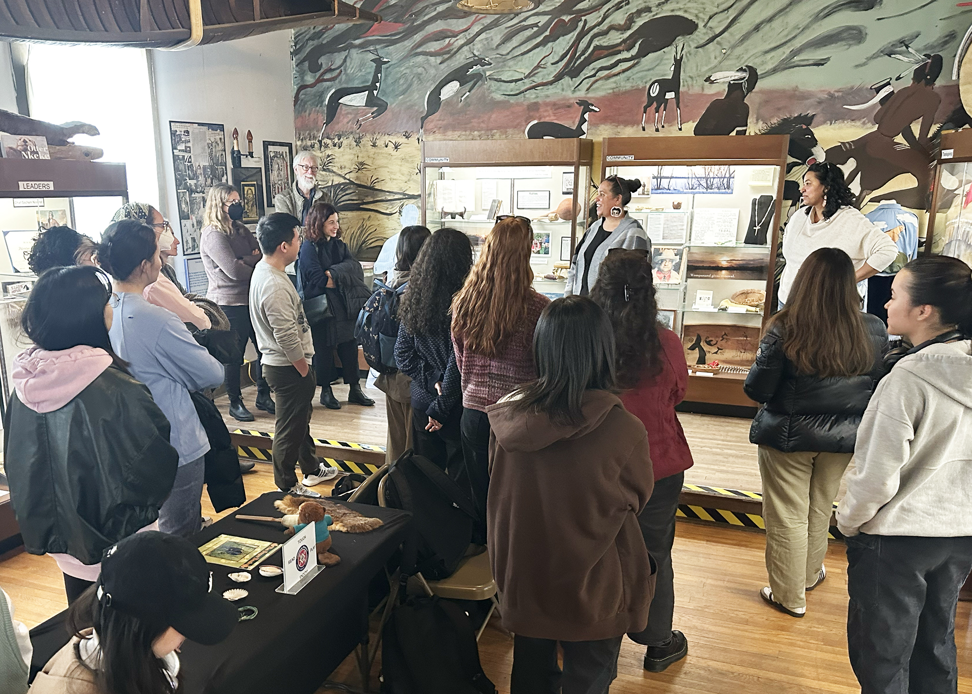 students gather in museum gallery
