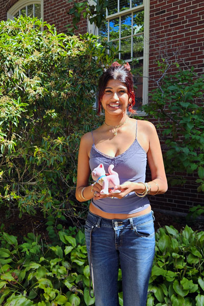 Ramya Rajan holds a handpainted ceramic cat