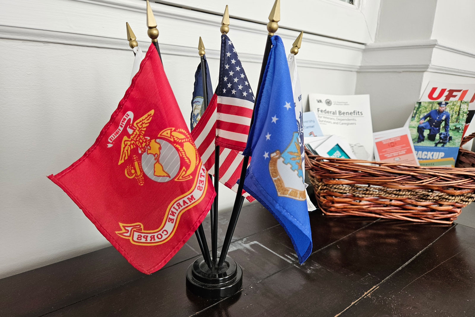 military flags sit on table in OMAS