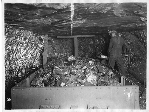 Miner loading coal