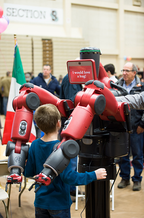 Robot hugging child