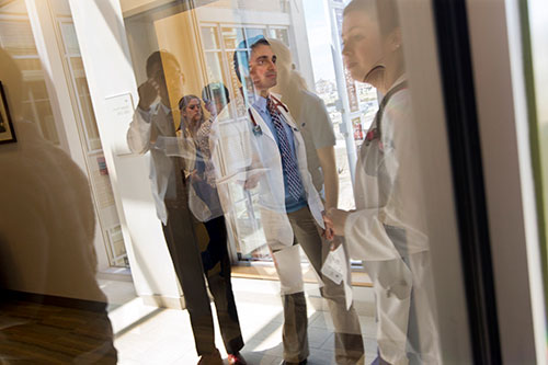 Students reflected in glass