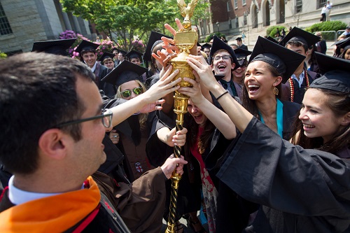 Rashid Zia with the Brown University mace during commencement