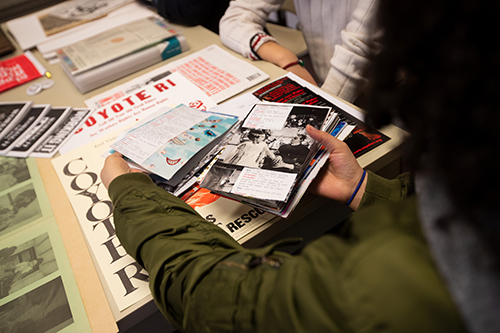 Malana Krongelb holding zine pages