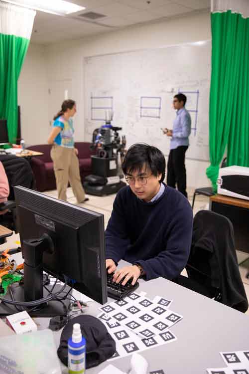 Atsu Kotani working on a computer