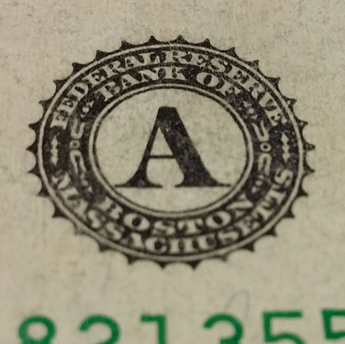 Federal Reserve emblem on money