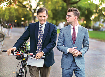 Jody Rich and Brandon Marshall walking across campus