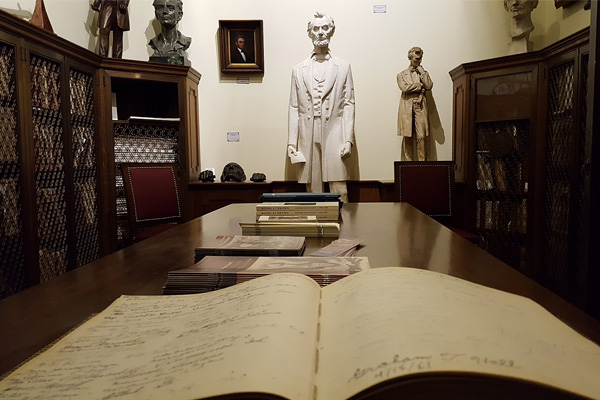 Statue of Lincoln overlooking book in John Hay library with MLK's signature