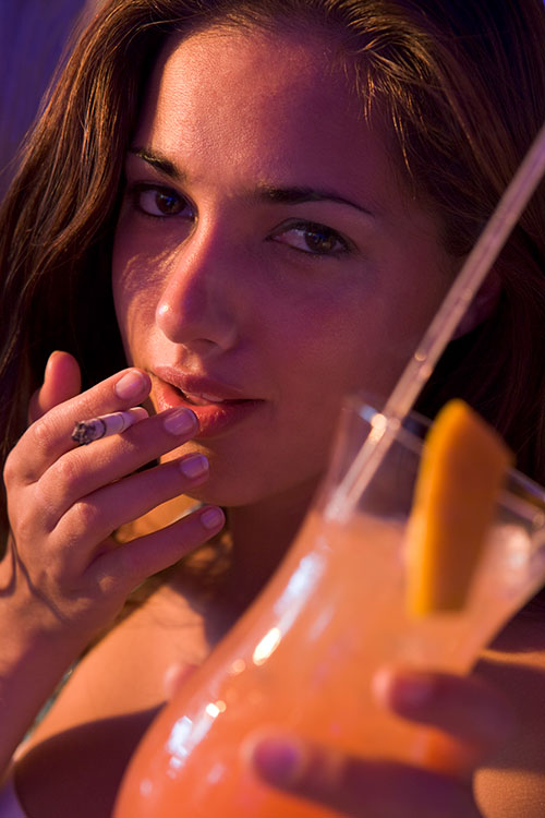 Young women drinking and smoking
