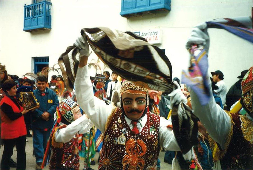 Dancers wearing masks at the Virgin of Carmen celebration in Peru