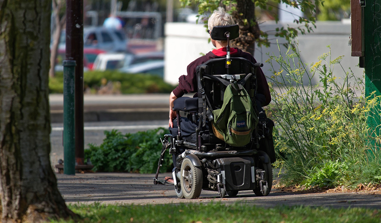 Man using motorized wheelchair