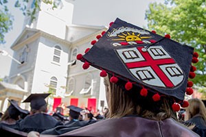 Brown shield on a mortarboard cap