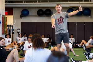 Mike Pimentel gives a thumbs up while working with a group of student-athletes